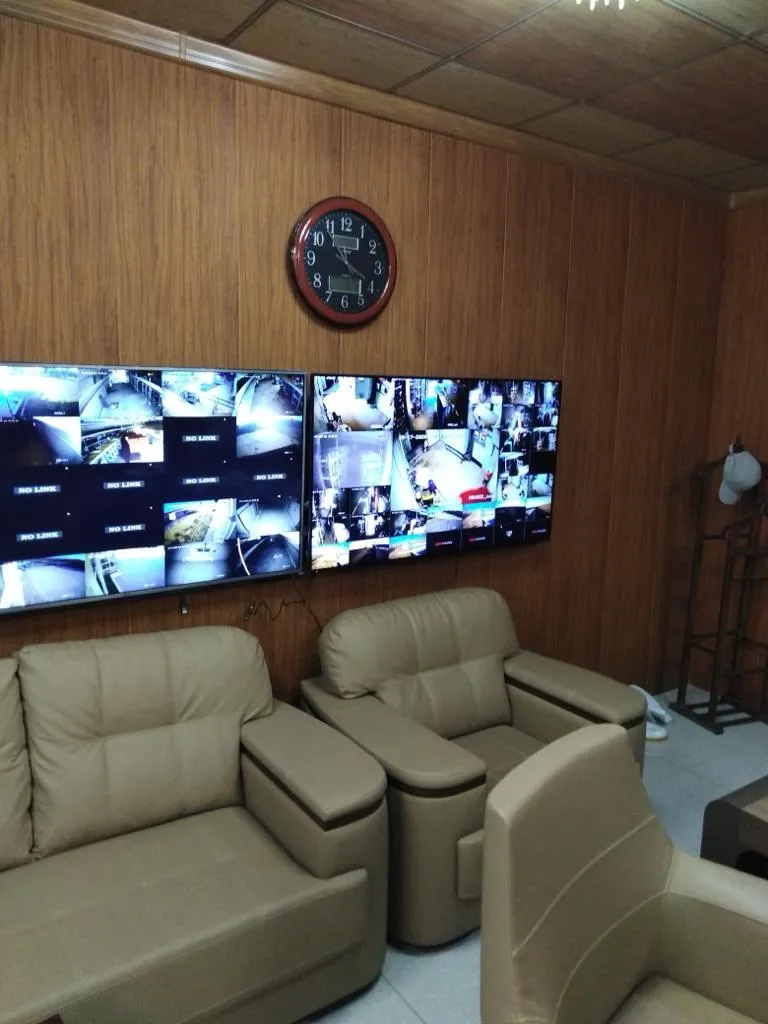 Monitoring room with a wall of CCTV screens